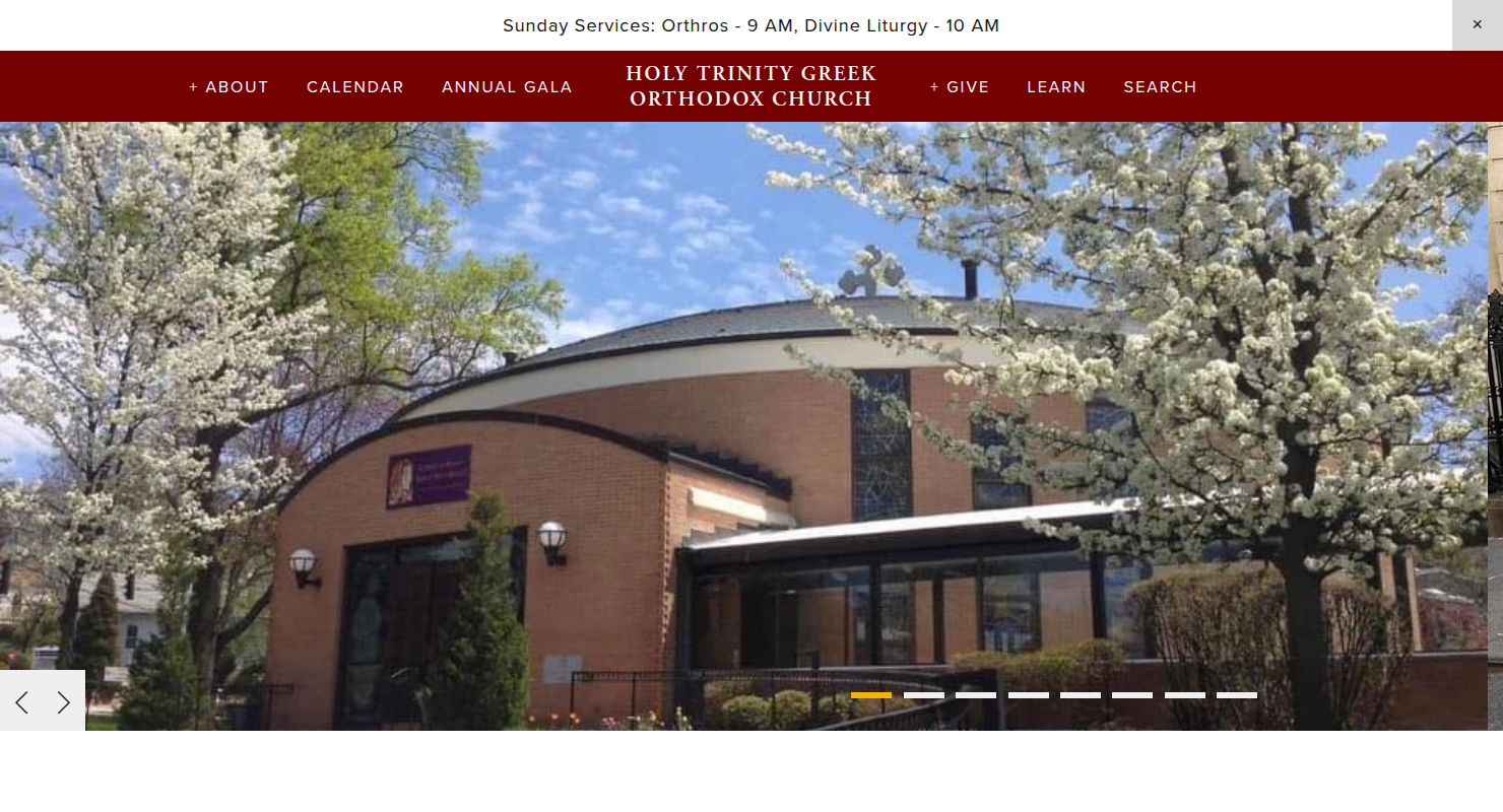 The Holy Trinity Greek Orthodox Church website, an example of a simple, modern static community site. Screenshot of the Holy Trinity Greek Orthodox Church website homepage with a large image of the church building framed by blooming trees.